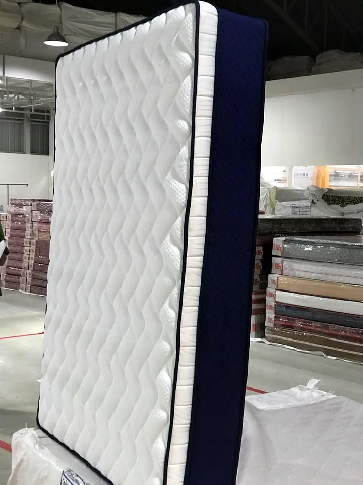 Quilted mattress standing upright on the Wood Crops factory floor, Chennai
